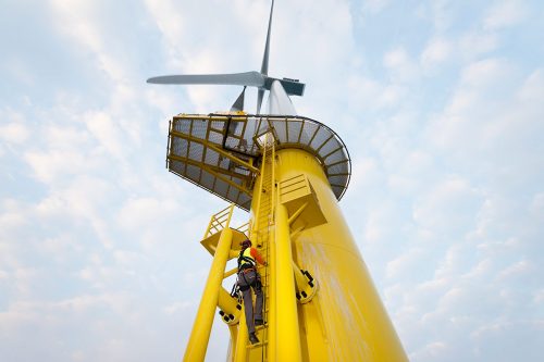 worker-climbing-wind-turbine